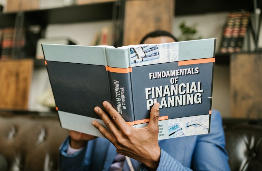 a man reading a book about financial planning