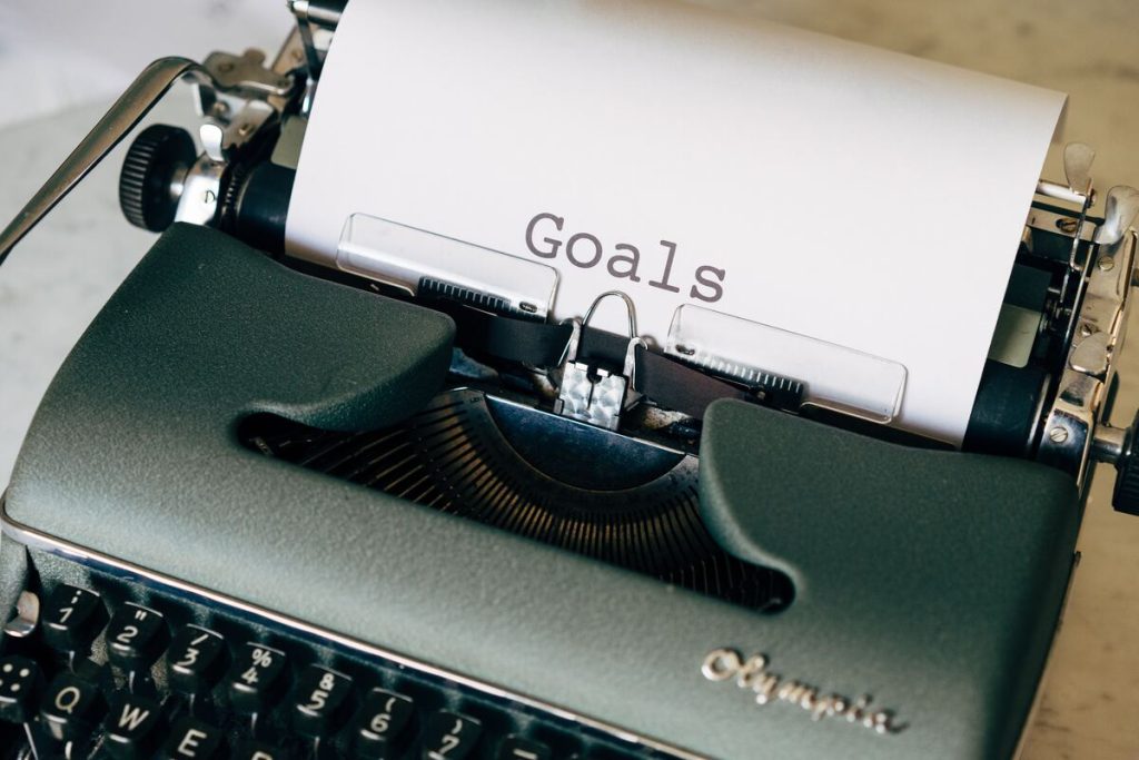 goal word in a paper in a typewriter