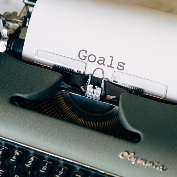 goal word in a paper in a typewriter